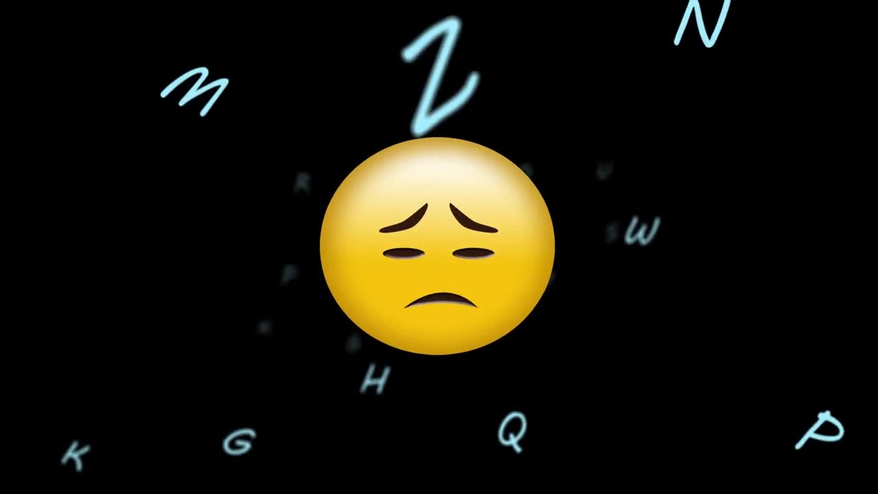 animación de un emoji triste sobre letras flotantes en un fondo negro