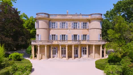 unique 18th century château de castille is built upon a 13th-century fortress foundation, aerial capturing front exterior classified as “historic monument” by the french state