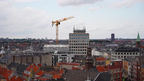 tower crane at building construction site seen from the round tower in copenhagen, denmark