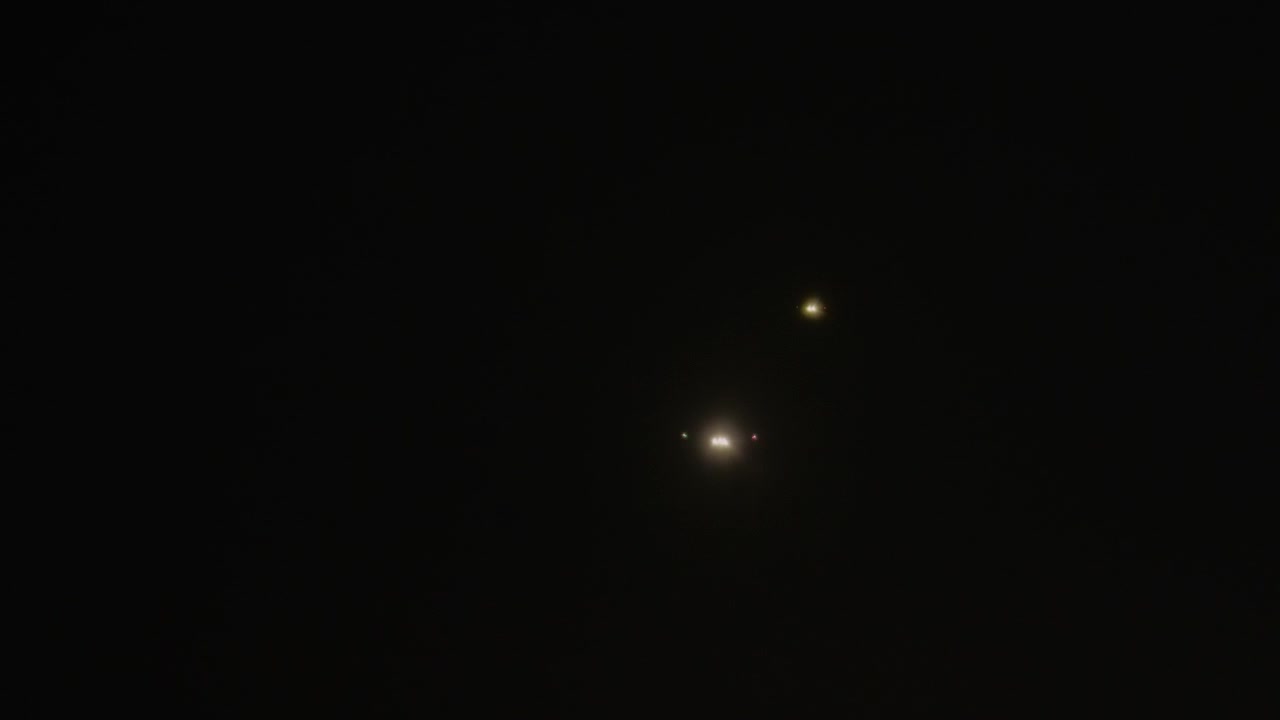 Airplane lights descend for landing