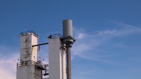 industrial silo against a blue sky