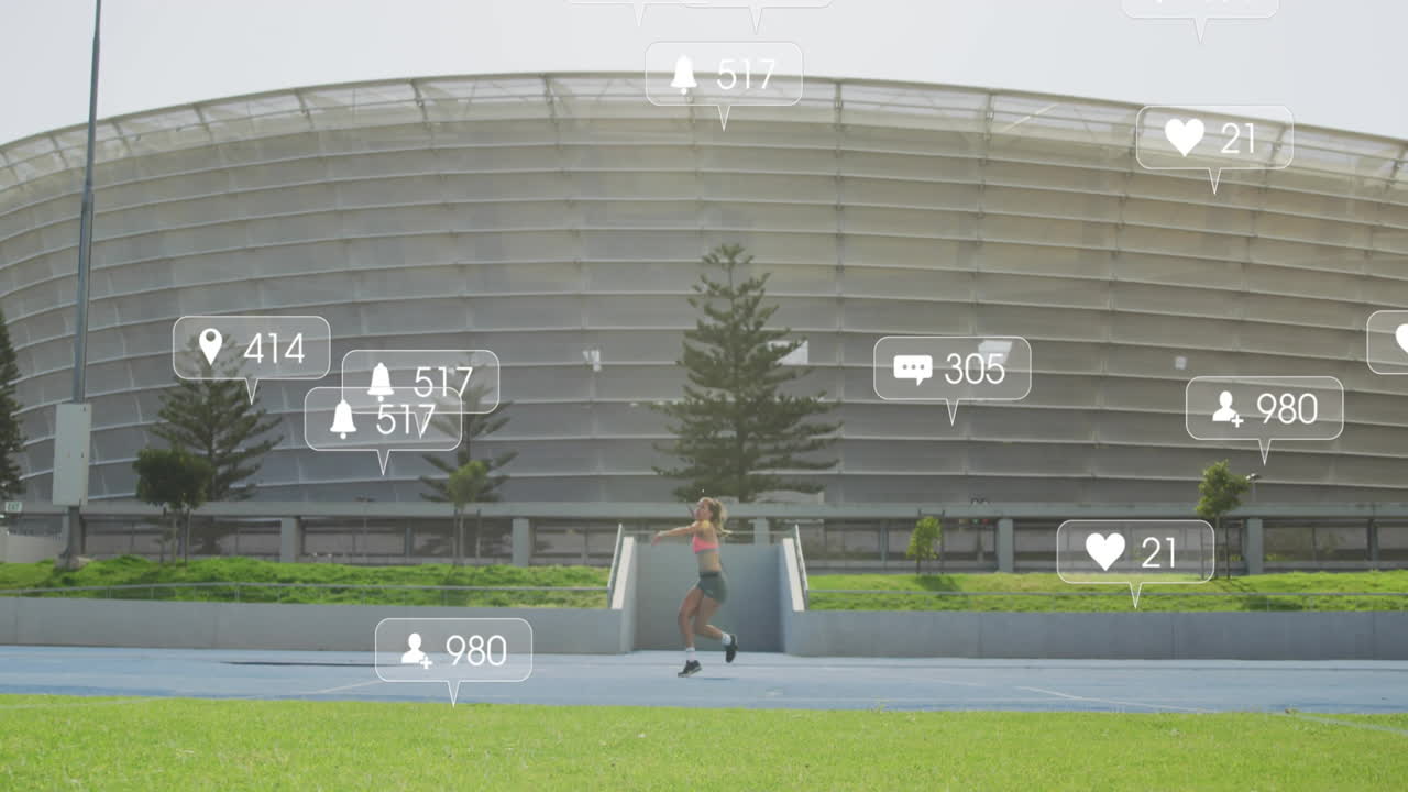 Woman running on blue track at modern stadium, showing health with floating social media icons