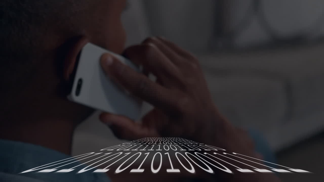 Person talking on phone with binary code animation overlaying scene