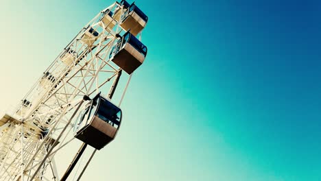 ferris wheel against a bright blue sky, place for text