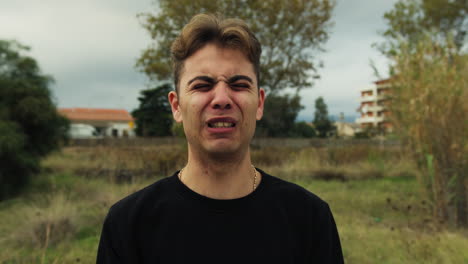 boy gym expressions of effort to lift impressive weights outdoor