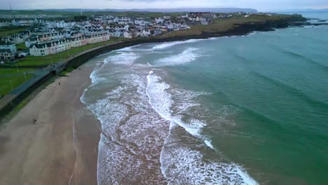 Wide-shot-of-Portrush-West-Strand-beach-on-a-moody-evening