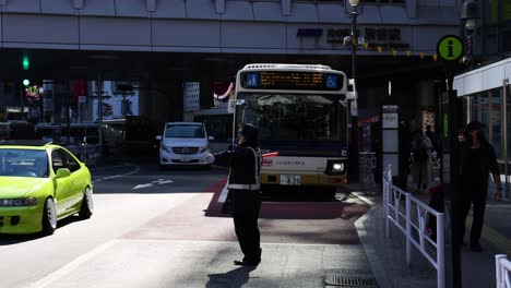 person navigating through traffic at crosswalk