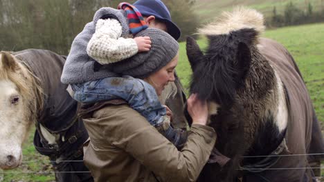 mother and child stroking horse on walk shot on r3d