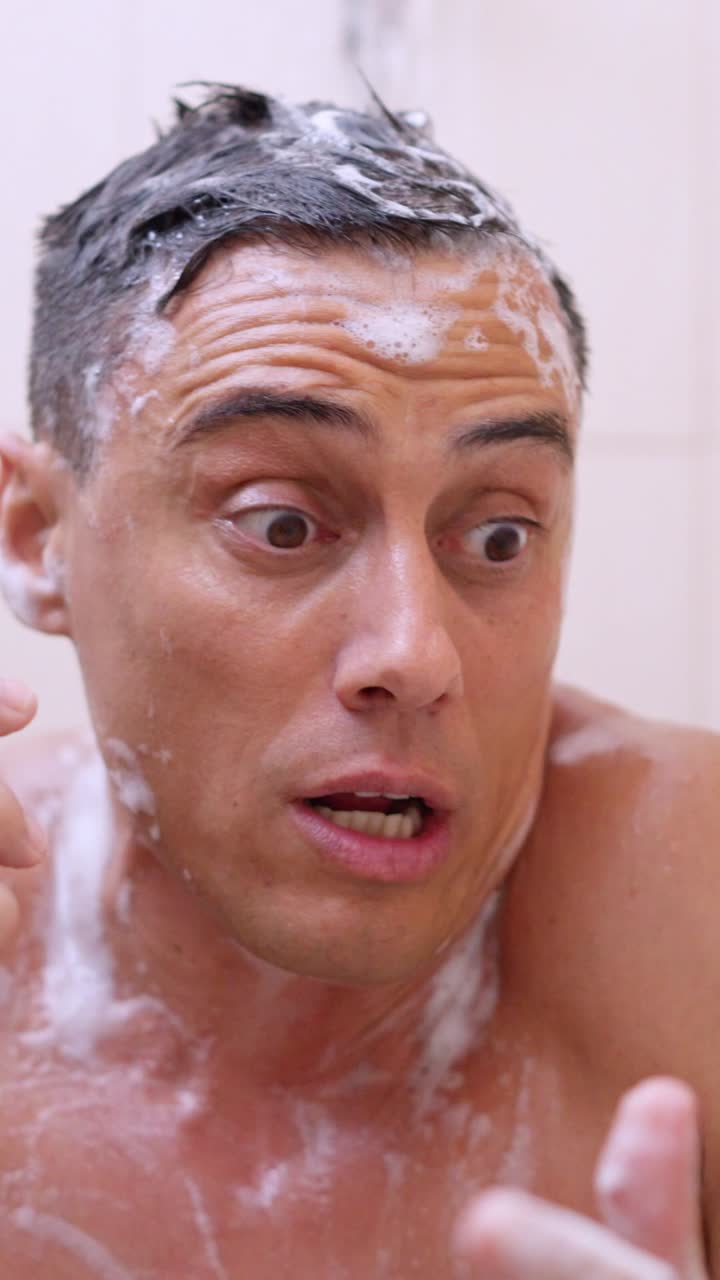 Man taking a shower and talking on the phone