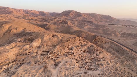 fly over luxor, valley of the kings in egypt in a hot air balloon at sunrise overlooking historical sites