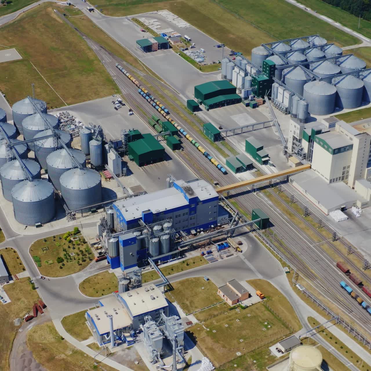 Modern enterprise for the production and storage of grain. Aerial survey of the territory of the plant. Storage complex for oilseed rape and other grains of agribusiness.