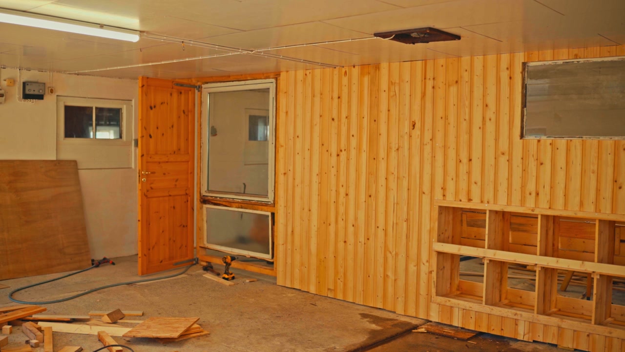 Man Renovating A Room With Groove Paneling - Timelapse