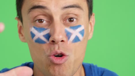 close up of a man supporting scottish team
