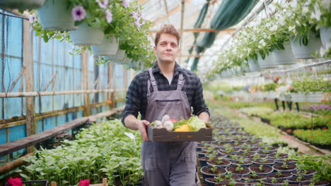 farmer carrying harvested vegetables in tray