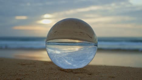 magic sunset view on the beach in a crystal ball.