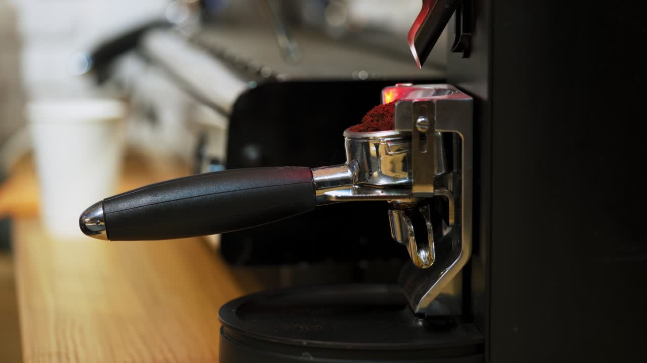 Barista making a cup of coffee. Making cup of coffee in coffee machine