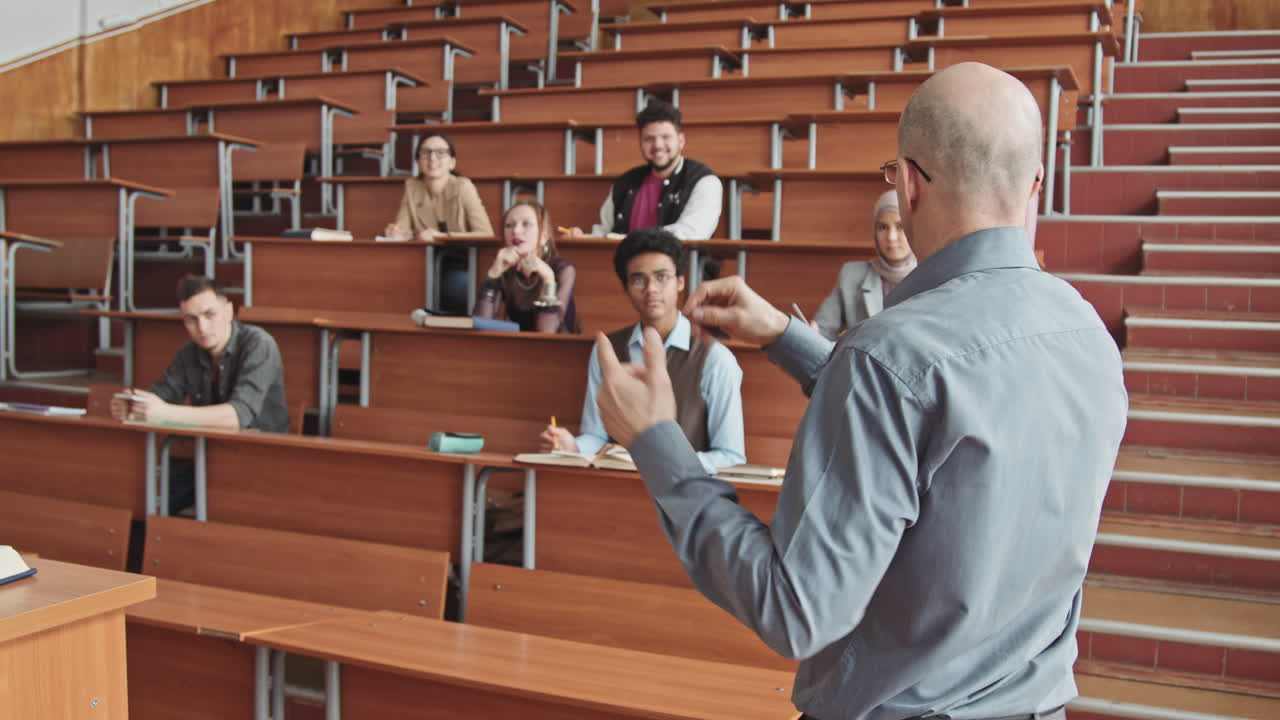 Male Professor Giving Lecture to Students