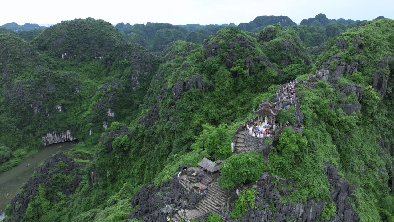 Hang mua peak temple and lush limestone hills in ninh binh, vietnam, aerial view