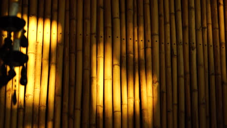 warm golden light moving on bamboo wall construction in oriental asiatic eastern style