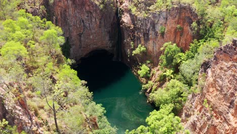 plunge pool of the tolmer falls amidst the high gorges in litchfield national park in australia