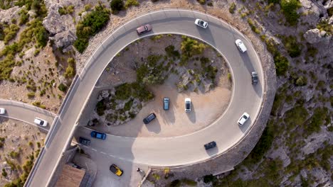 top down aerial of cars driving on nus de sa corbata, mallroca