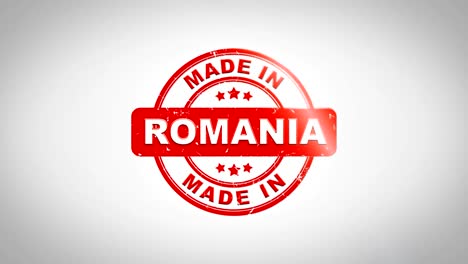 made in romania signed stamping text wooden stamp animation. red ink on clean white paper surface background with green matte background included.