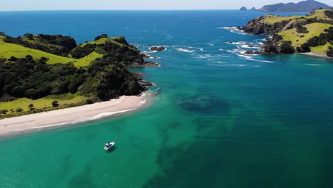 Yacht-Floating-On-Turquoise-Blue-Water-Of-Ocean-Near-Urupukapuka-Island-During-Summer-In-New-Zealand