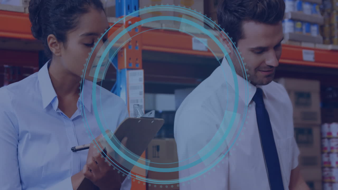 Discussing logistics in warehouse, business professionals using digital animation interface