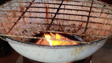 grill with flames at floating market in bangkok