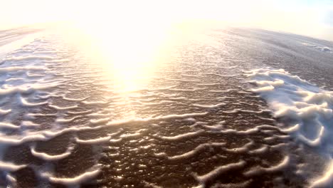 algae foam in storm on the beach, sandy beach with waves, north sea, jütland, sondervig, denmark, 4k