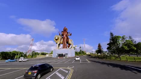 majestic hindu statue of lord shiva at grand bassin sacred lake in mauritius, featuring the world's third-tallest shiva sculpture amid tropical scenery.