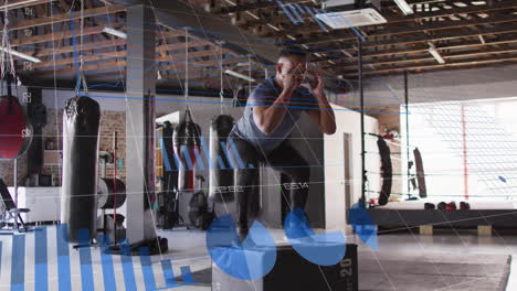 man exercising in gym with fitness data analysis animation over workout equipment