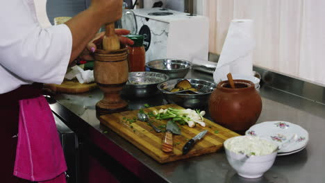 female chef preparing traditional georgian food, medium shot