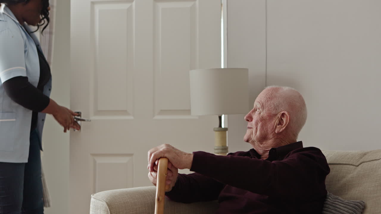 Elderly man with caregiver at home