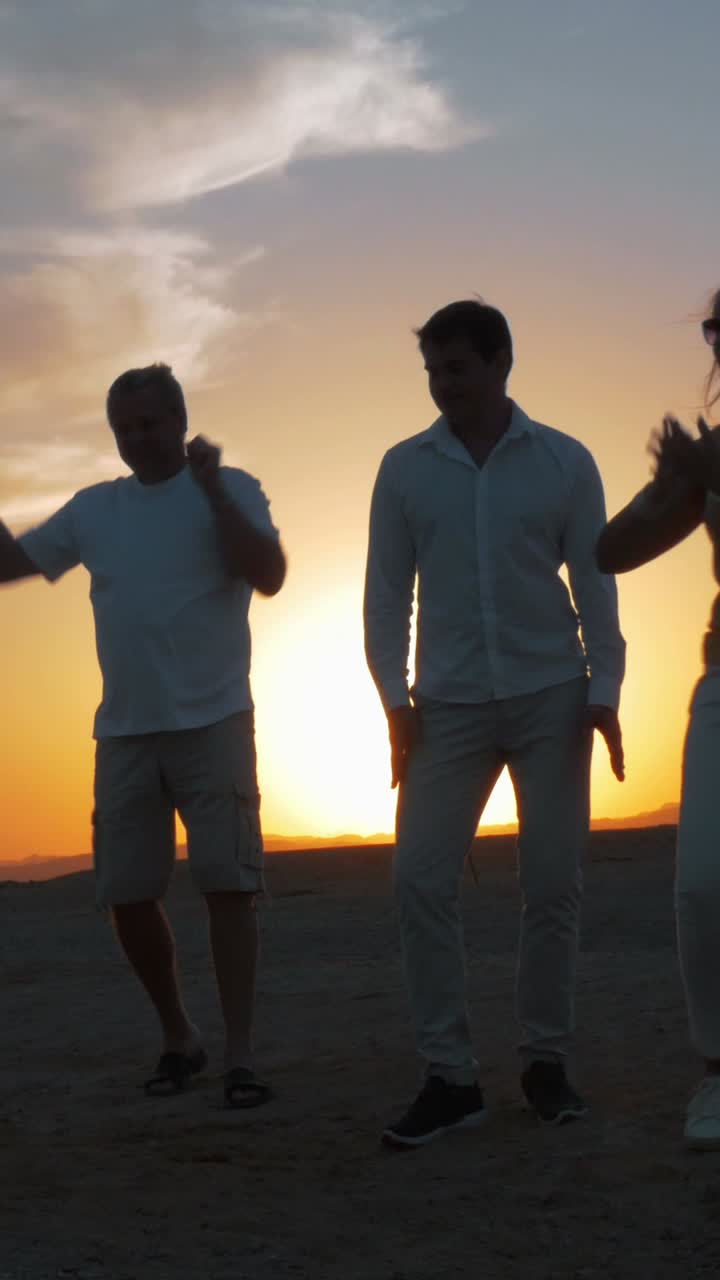 Silhouetted People Enjoying Sunset