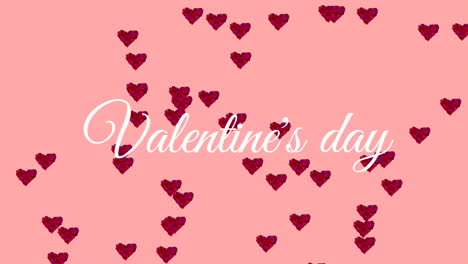 valentines day text with hearts on pink background