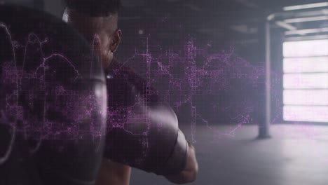 Digital-composite-video-of-purple-digital-waves-against-male-boxer-punching-a-punching-bag