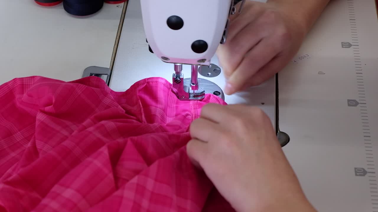 Sewing pink fabric with a sewing machine