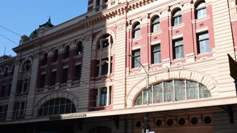 people and cars at historic train station