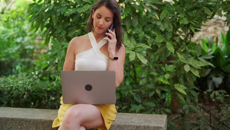 Female-freelancer-working-remotely-in-summer-park