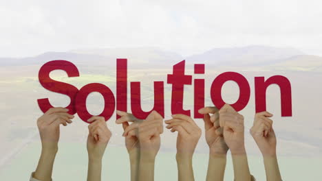 animation of hands holding solution text over landscape