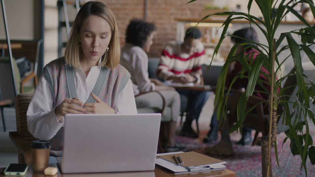 Woman on a video call in a cafe