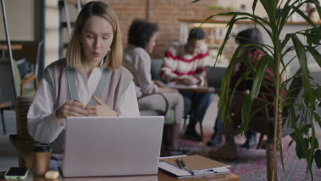 woman on a video call in a cafe