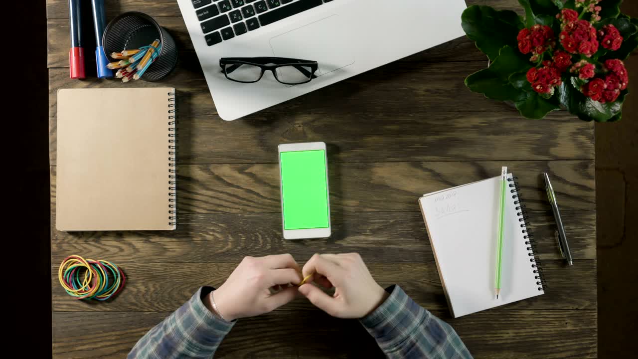 Top view of wooden table with office supplies