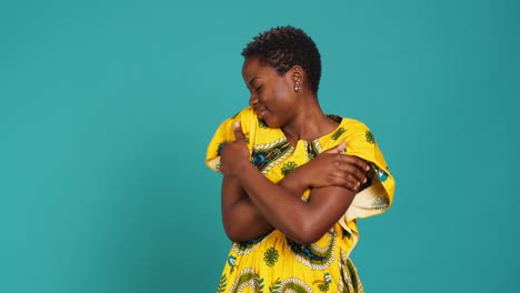 Confident-young-woman-representing-her-african-ethnicity-wearing-tribal-dress