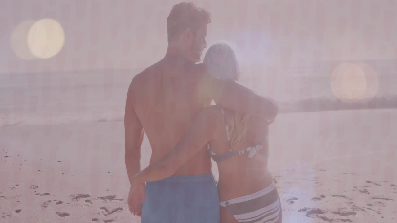 Embracing on sandy beach, couple enjoying ocean view and animation together