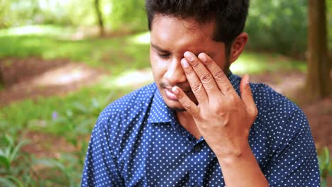 Close-up-of-upset-man-suffering-from-strong-eye-pain