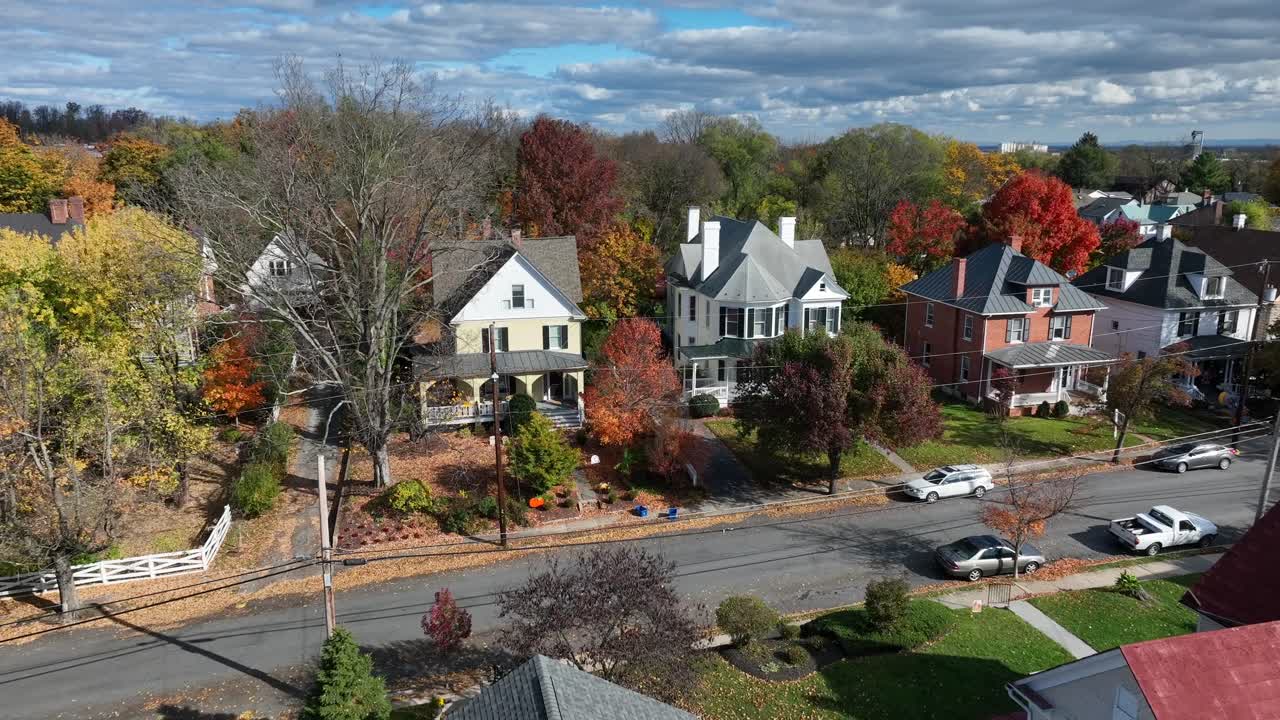 Suburban homes amidst autumn foliage