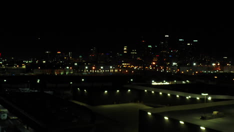 Ascending-shot-of-downtown-Georgia's-skyline-at-night