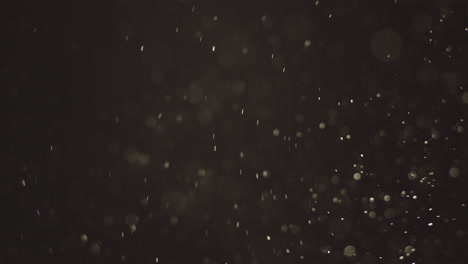 partículas en fondo oscuro
